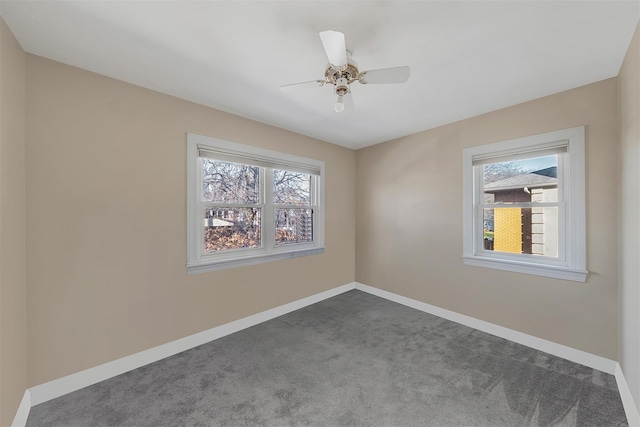 carpeted empty room featuring ceiling fan