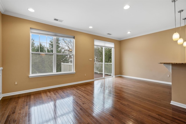 unfurnished living room with dark hardwood / wood-style flooring and crown molding