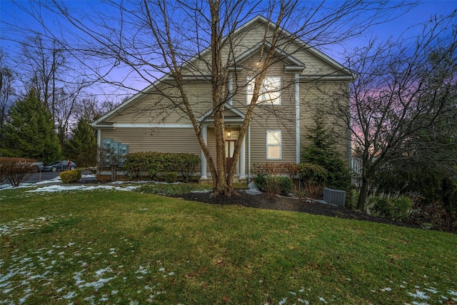 traditional home featuring a lawn