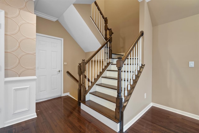 stairs featuring wood finished floors and baseboards