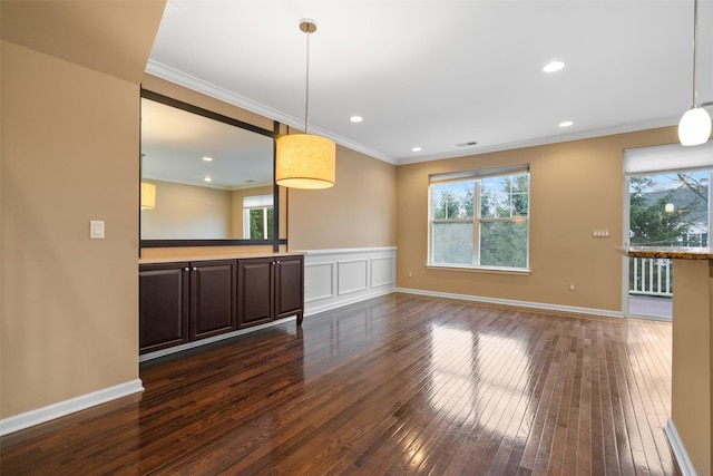 spare room featuring dark wood-style floors, crown molding, recessed lighting, visible vents, and baseboards