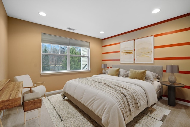 bedroom with recessed lighting, baseboards, visible vents, and light colored carpet