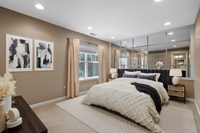 bedroom with recessed lighting, visible vents, baseboards, and light colored carpet