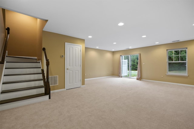 interior space featuring light carpet, stairway, visible vents, and recessed lighting