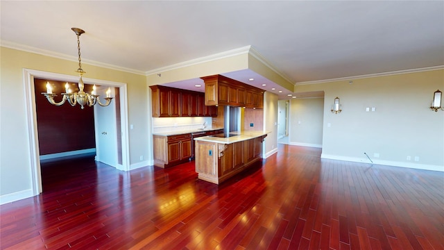 kitchen with dark wood-type flooring, an inviting chandelier, black electric cooktop, ornamental molding, and decorative light fixtures