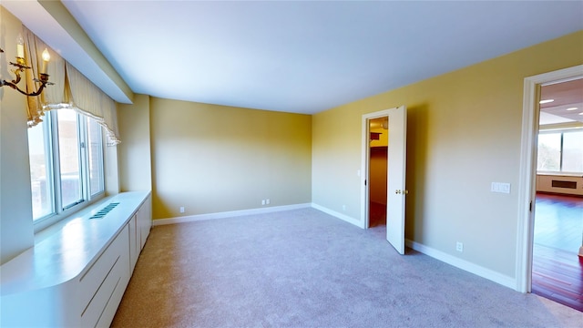 empty room featuring light carpet