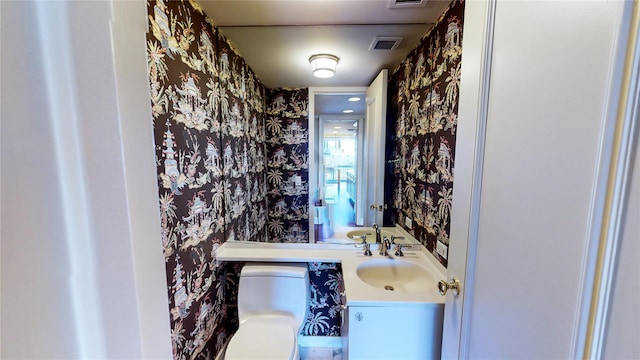 bathroom with vanity and toilet