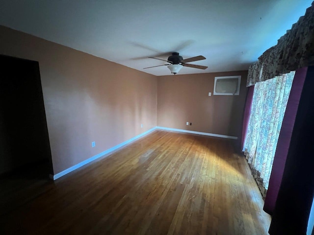 spare room featuring hardwood / wood-style floors and ceiling fan