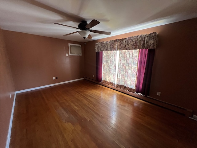 spare room featuring ceiling fan and hardwood / wood-style floors