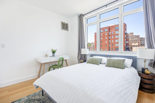 bedroom featuring hardwood / wood-style flooring