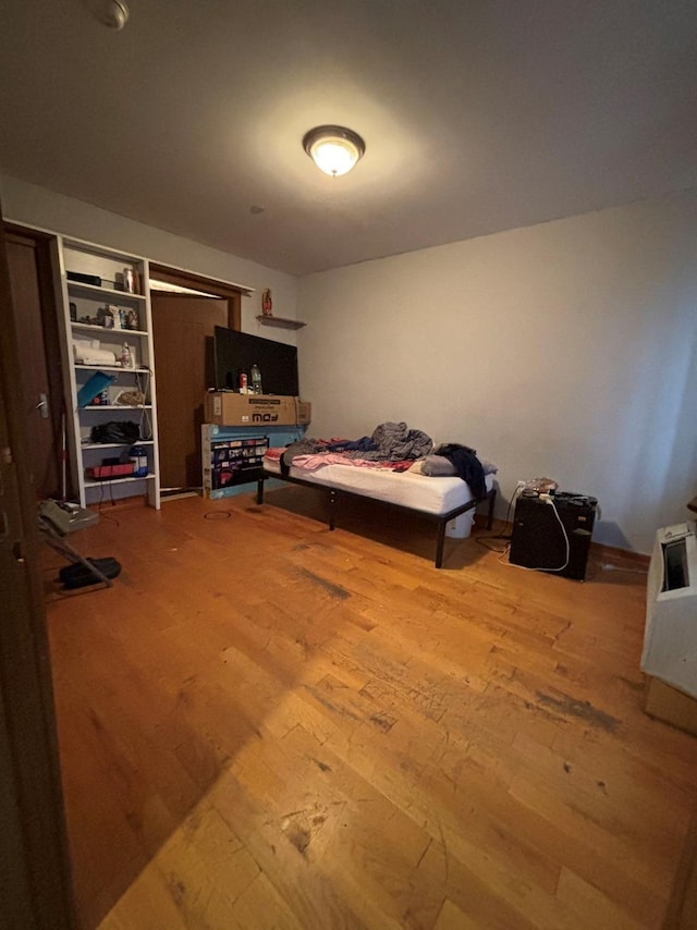 bedroom with hardwood / wood-style floors