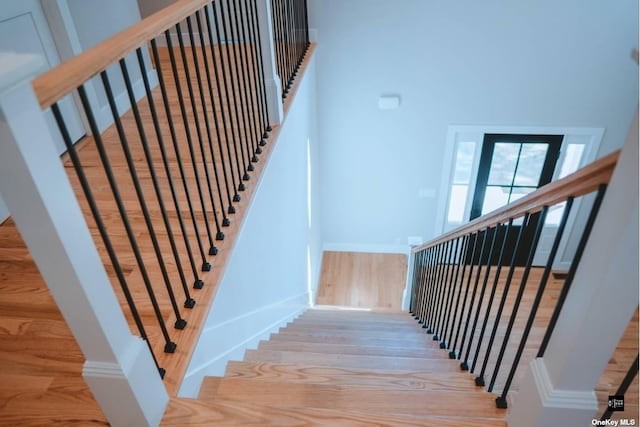 staircase featuring hardwood / wood-style flooring