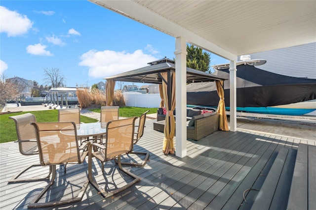 wooden terrace featuring a gazebo