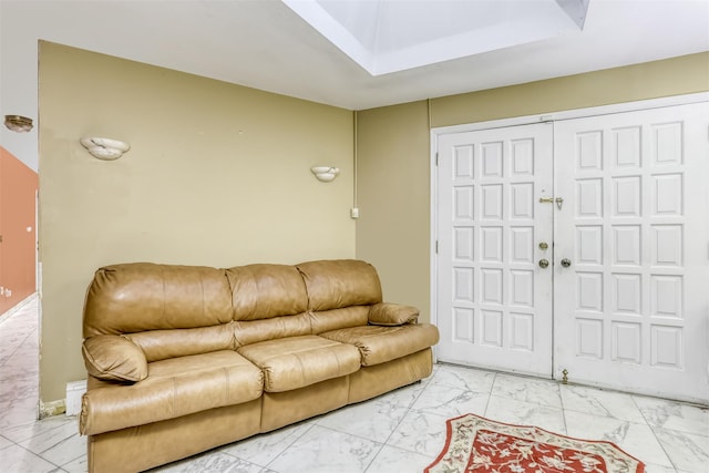 living room featuring a raised ceiling