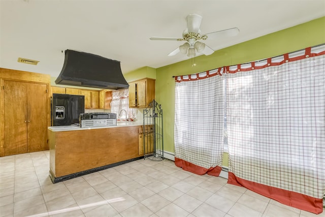 kitchen with black refrigerator with ice dispenser, ventilation hood, sink, ceiling fan, and kitchen peninsula