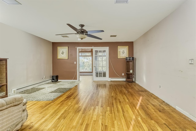 unfurnished living room featuring hardwood / wood-style flooring, ceiling fan, and a baseboard radiator