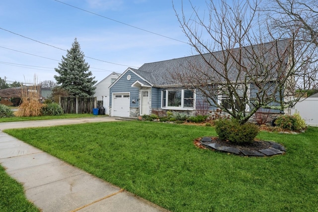 ranch-style home with a garage and a front yard