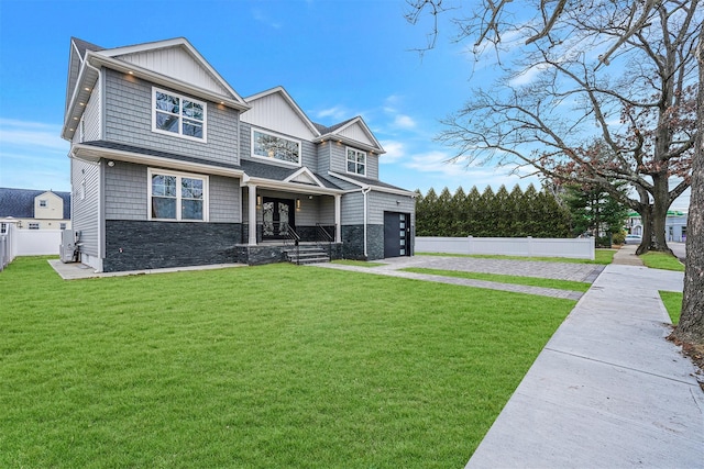 view of front of property with a garage and a front yard