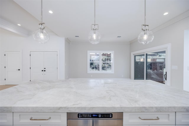 kitchen with white cabinetry, crown molding, and pendant lighting