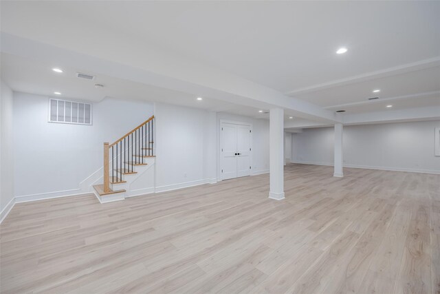 basement featuring light hardwood / wood-style floors