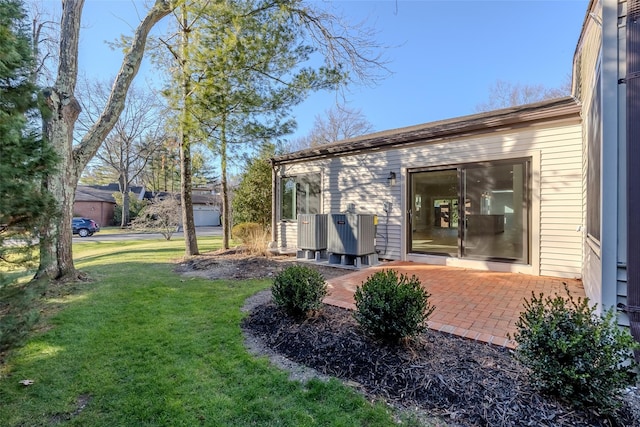 view of yard with a patio area and central AC unit