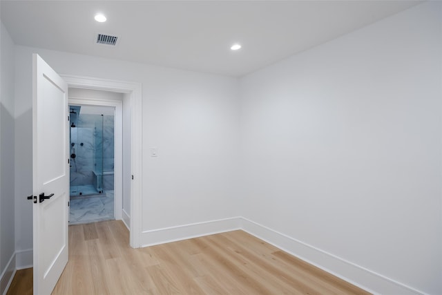 empty room with visible vents, recessed lighting, light wood-style floors, and baseboards