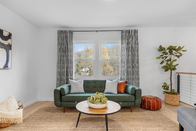 living area with hardwood / wood-style flooring