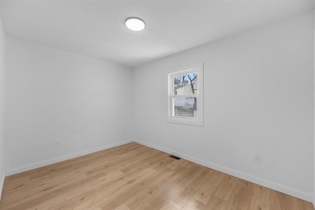 unfurnished room featuring light hardwood / wood-style flooring