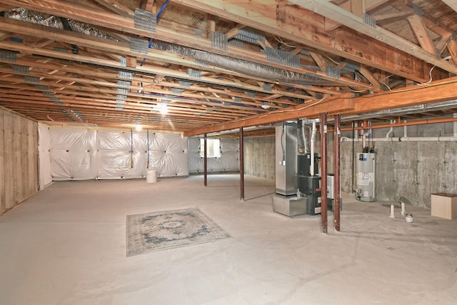 basement with gas water heater and heating unit