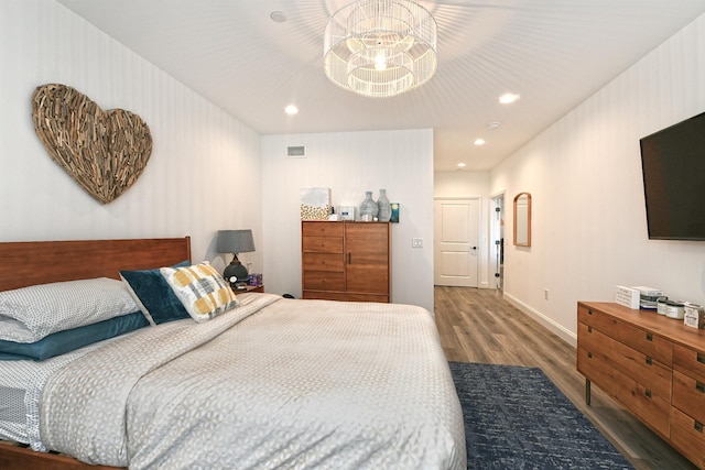 bedroom with dark wood-type flooring