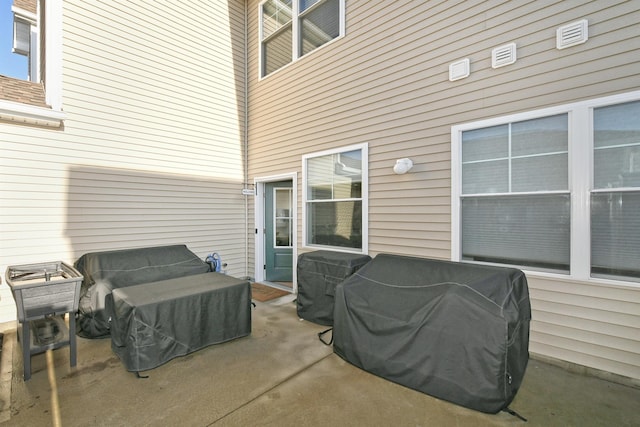 view of patio featuring a grill