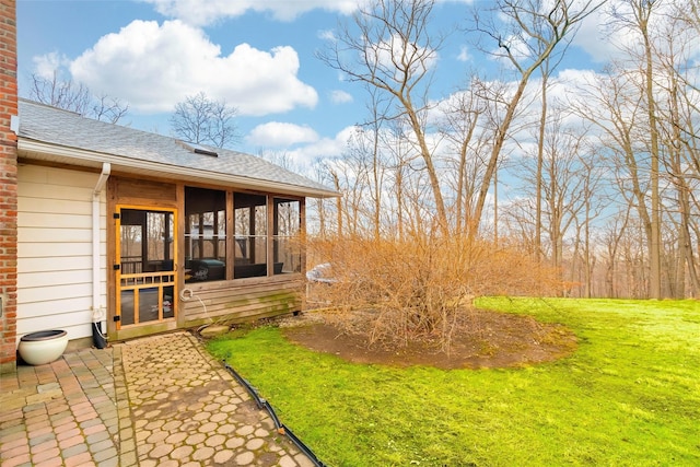 view of yard featuring a sunroom