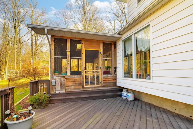 wooden terrace featuring a sunroom