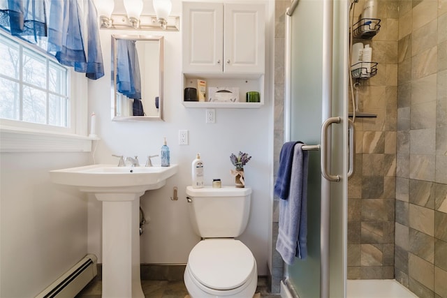 bathroom featuring walk in shower, a baseboard radiator, and toilet