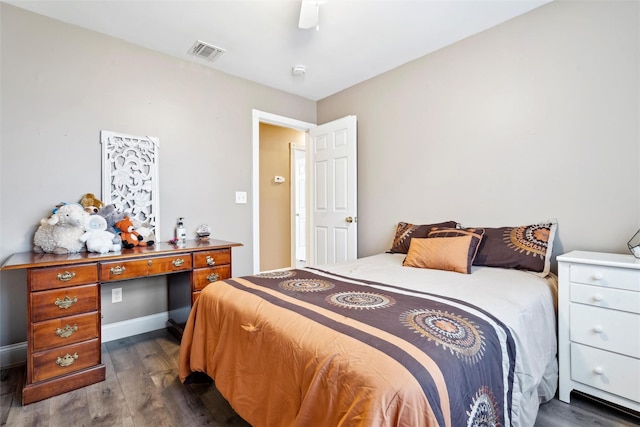 bedroom featuring ceiling fan and dark hardwood / wood-style flooring