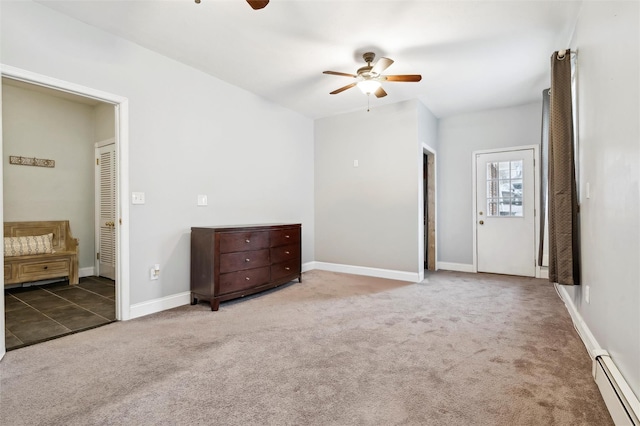 interior space with ceiling fan and a baseboard radiator