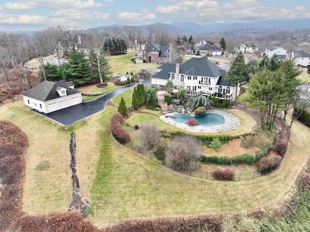 birds eye view of property with a mountain view