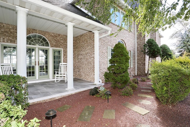 doorway to property featuring covered porch