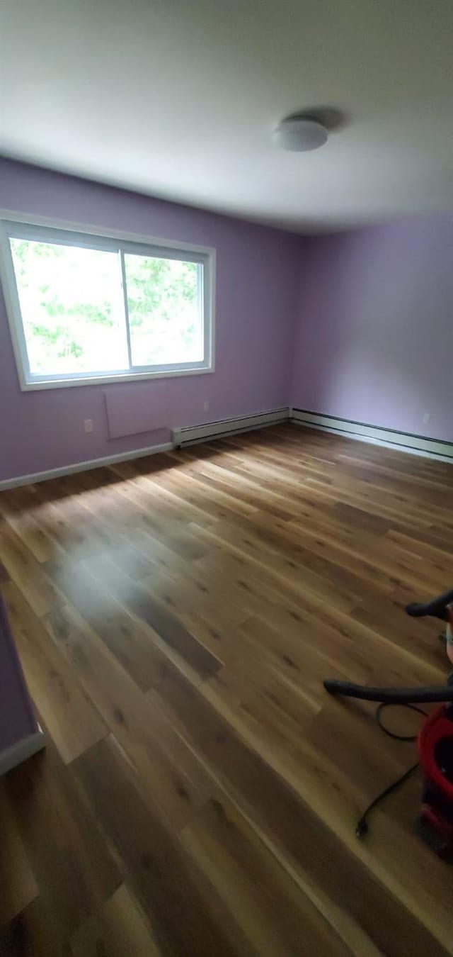 spare room featuring dark hardwood / wood-style flooring