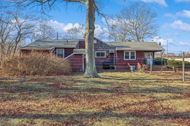 exterior space featuring central AC and a yard