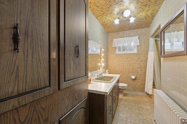 full bathroom featuring brick ceiling, vanity, vaulted ceiling, radiator heating unit, and toilet