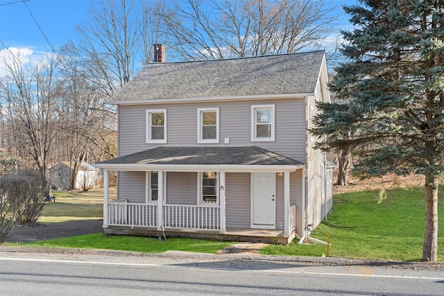 view of front facade featuring a porch and a front yard