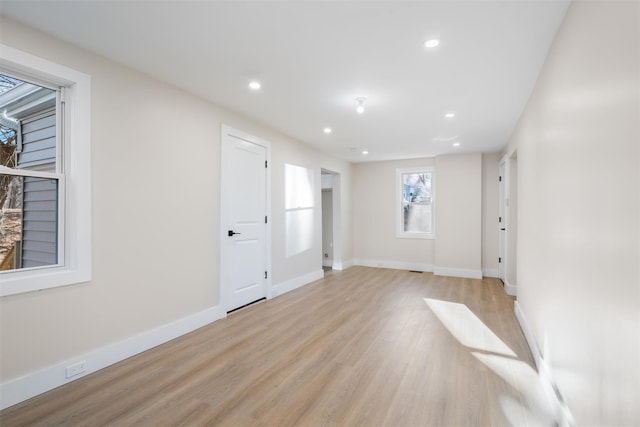 spare room featuring light hardwood / wood-style floors