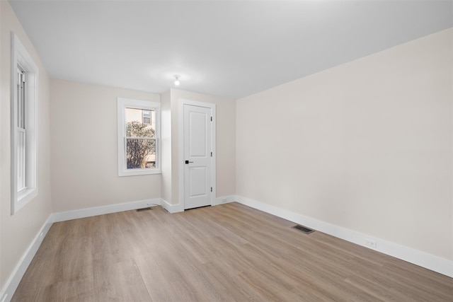 spare room with light hardwood / wood-style flooring