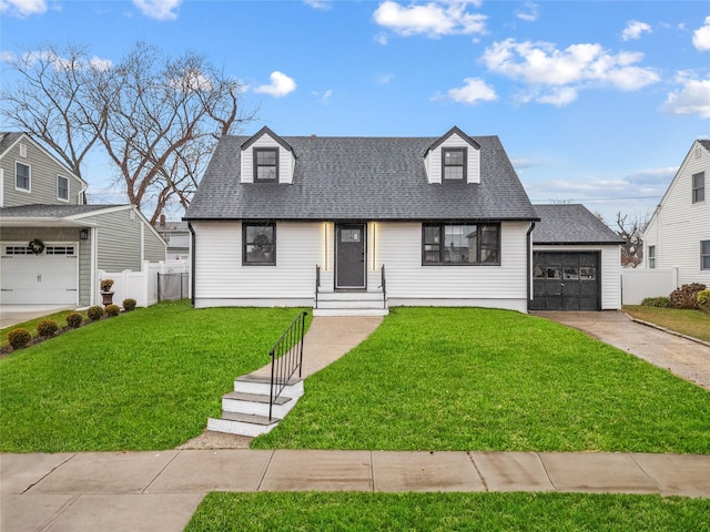 view of front of property with a front lawn and a garage