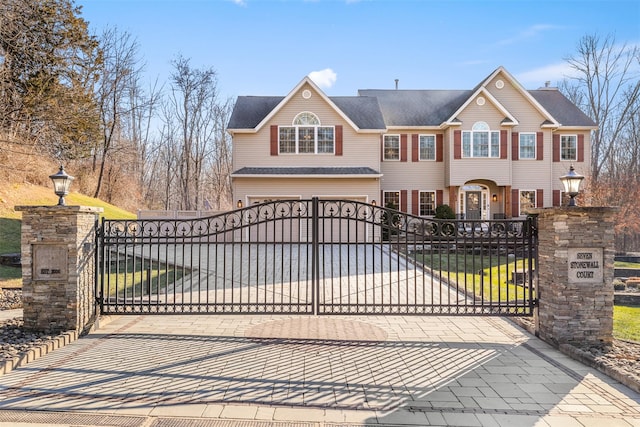 view of gate with a garage