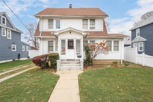 front facade featuring a front lawn