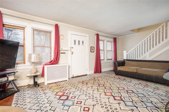 living room featuring radiator heating unit and light wood-type flooring