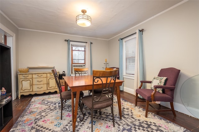 dining area with cooling unit, ornamental molding, and dark wood-type flooring