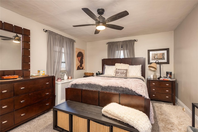 bedroom with light carpet and ceiling fan